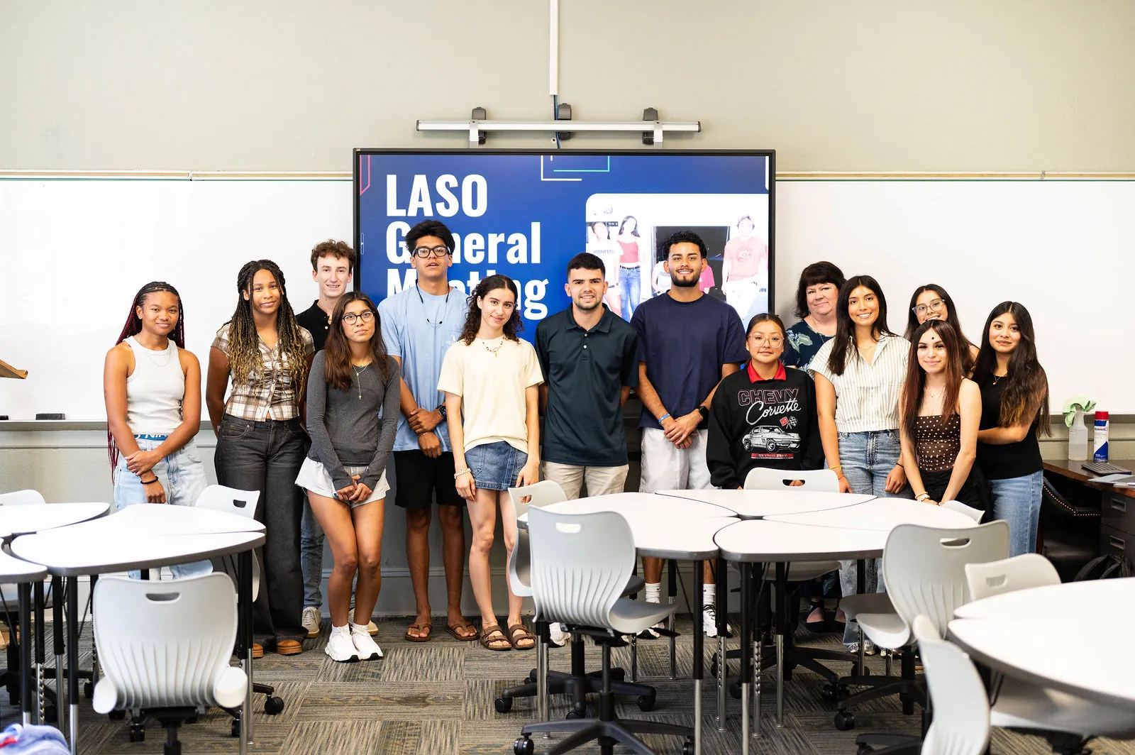 LASO members posing in front of the General Meeting slide, photograph by Samantha.Visions